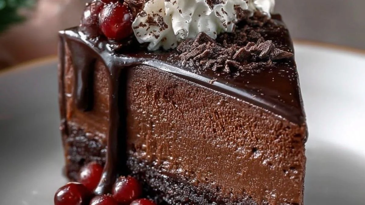 Sliced Black Forest Mousse Cake topped with cherries and whipped cream