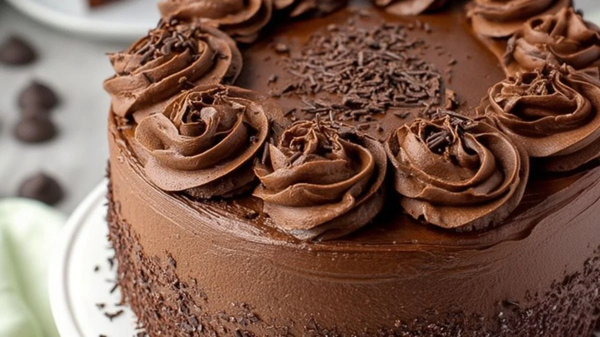 Classic Chocolate Celebration Cake 2 Moist Classic Chocolate Celebration Cake layered with rich ganache and topped with fresh raspberries and edible gold leaf