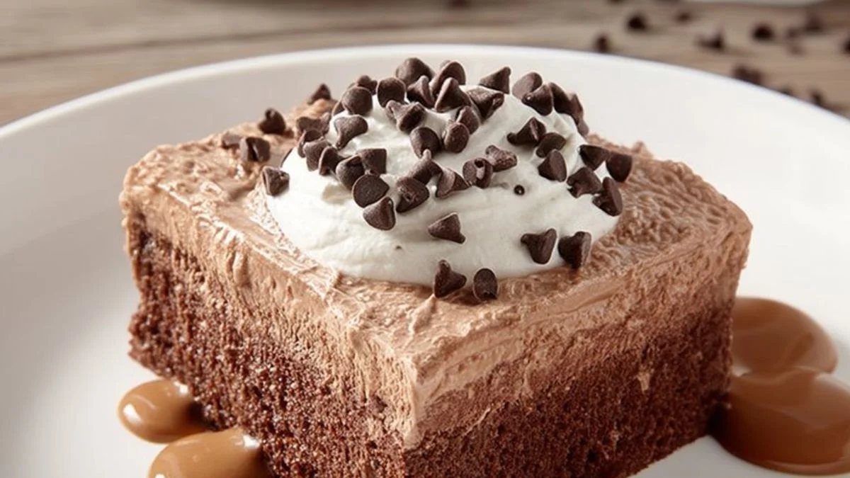 Chocolate Crown Cake 2 A decadent Chocolate Crown Cake with glossy ganache, edible gold leaf, and fresh raspberries