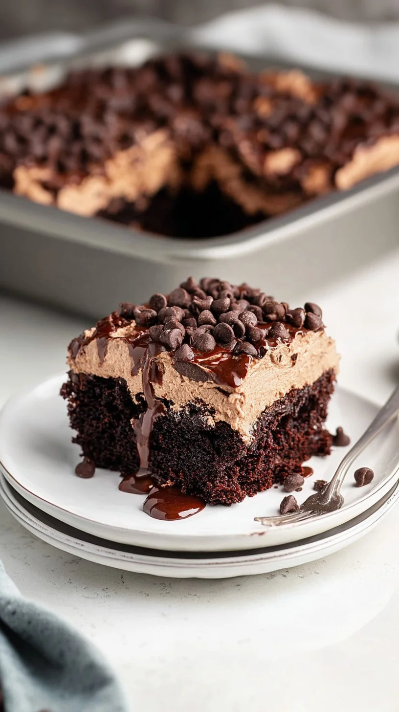 Slice of triple-layer chocolate cake with dark, milk, and white chocolate layers drizzled in glossy ganache and topped with chocolate curls.