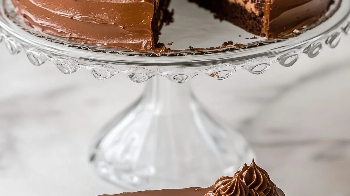 Layered Chocolate Dream Cake 3 Close-up of a Layered Chocolate Dream Cake with glossy chocolate ganache and chocolate shavings